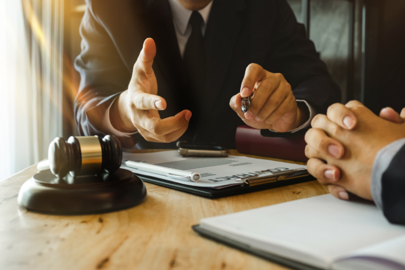 business people and lawyers discussing contract papers sitting at the table. Concepts of law, advice, legal services. in morning light